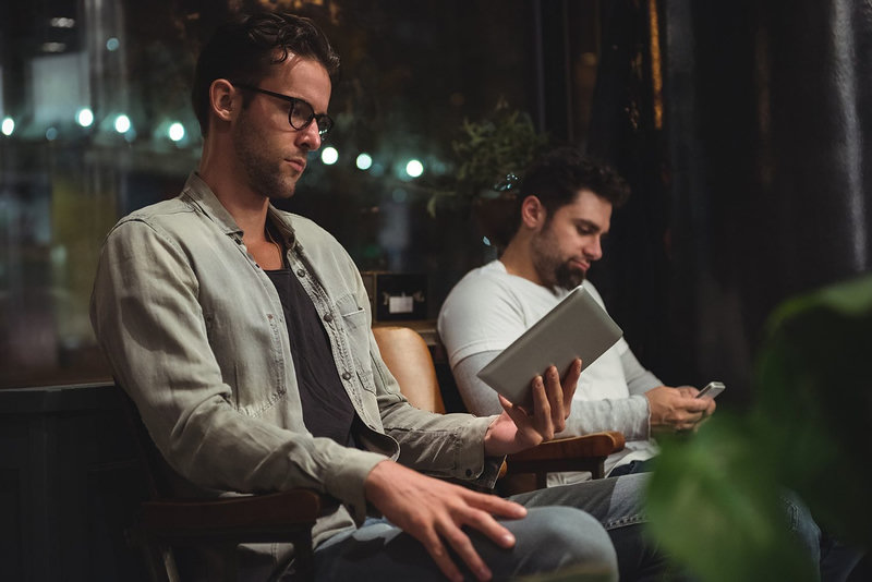 Salon clients using a digital tablet