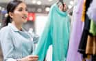 Woman choosing clothes in a retail boutique