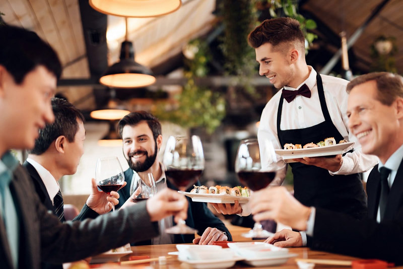 Waiter serving drinks in a restaurant